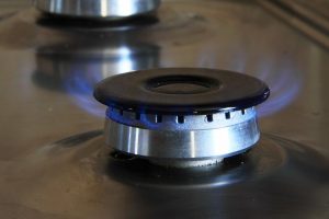 Blue flame on a stovetop burner